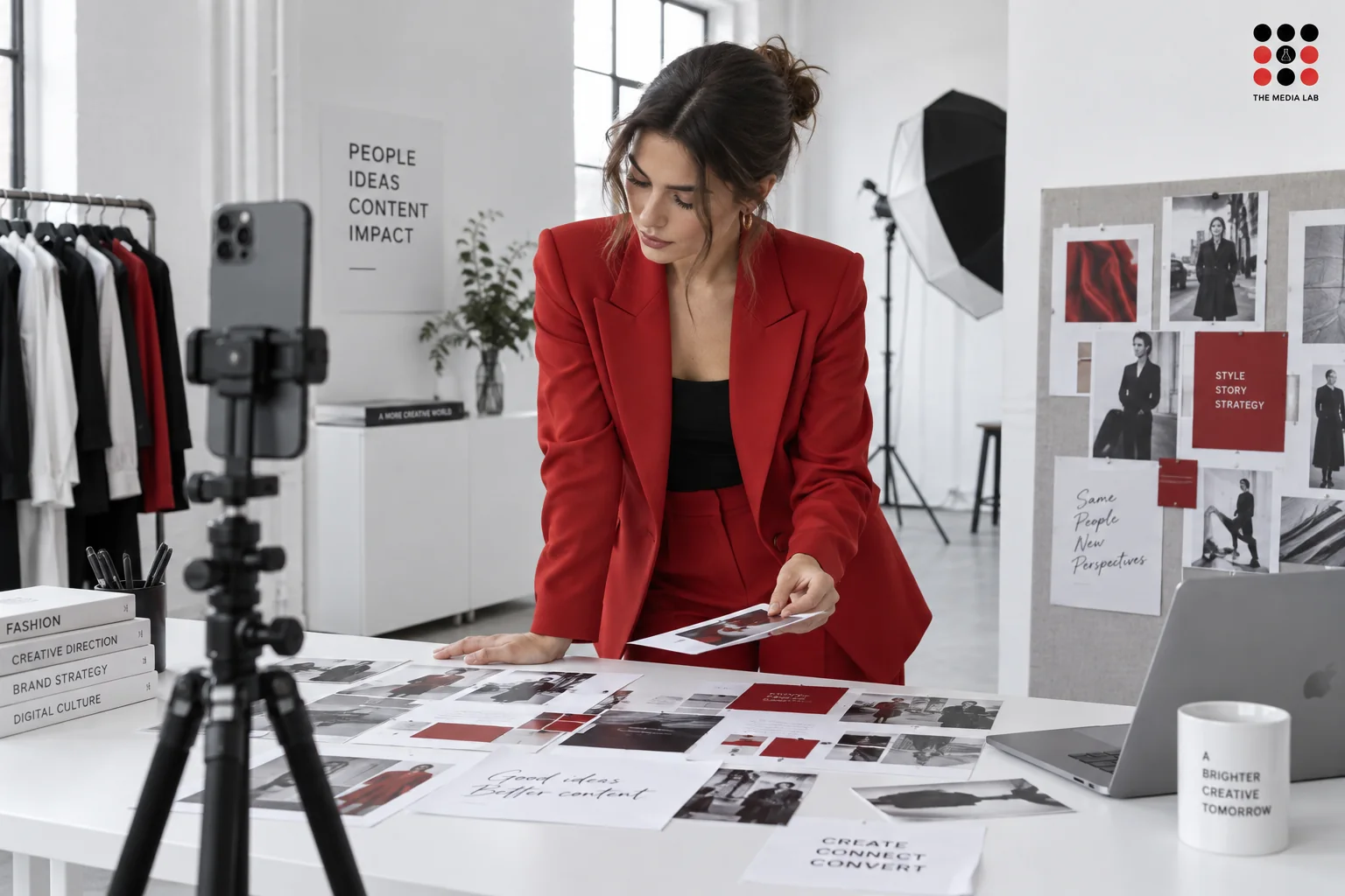 Creator reviewing a campaign moodboard in a white studio — UAE influencer selection illustration for The Media Lab.