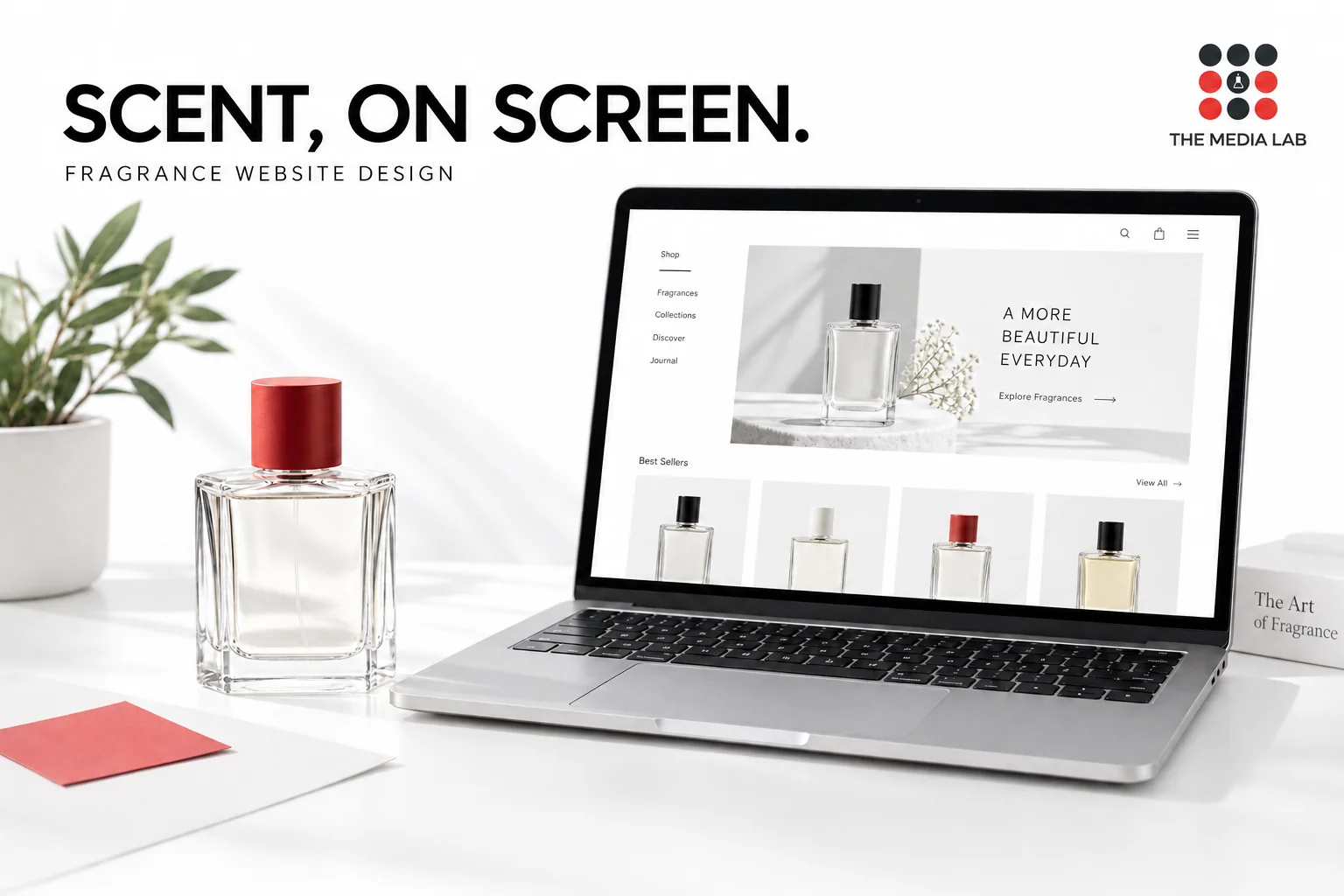 Perfume bottle beside a laptop with a fragrance shop concept, illustrating The Media Lab’s luxury perfume website design article.