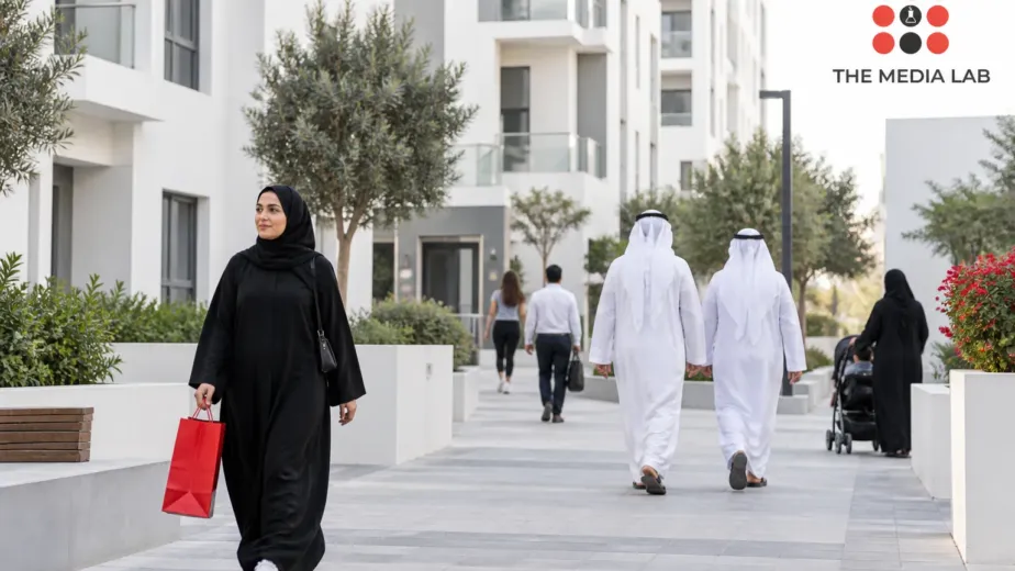 People walking through a UAE residential neighbourhood, an editorial concept for The Media Lab’s population guide.