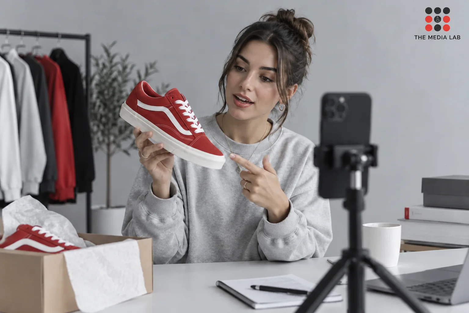 Creator demonstrating a sneaker for short-form brand content — The Media Lab concept image.